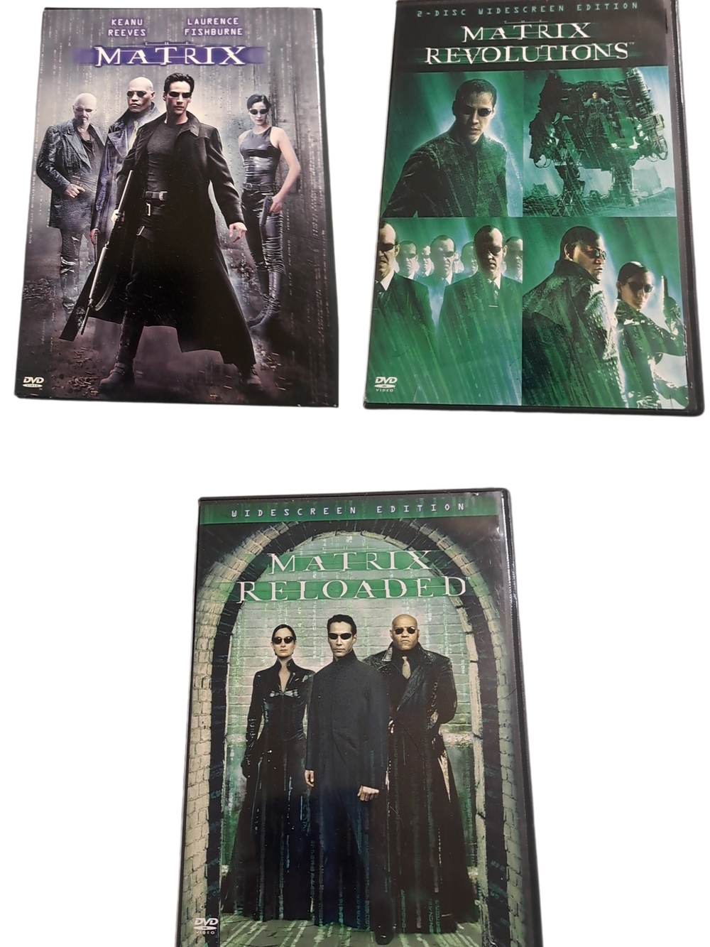 The Matrix Trilogy DVD Lot – The Matrix, Reloaded & Revolutions (4 Discs)